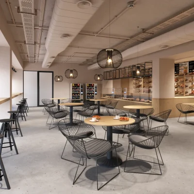 Die helle und moderne Lobby eines Berliner Bürogebäudes mit Rezeption und Sitzgelegenheiten.