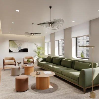 Das Bild zeigt eine moderne Lounge im Hansahaus Dortmund mit grünem Sofa, Designelementen und großen Fenstern.
