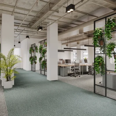 Das Bild zeigt eine offene Bürofläche im Hansahaus Dortmund mit modernen Arbeitsplätzen, Begrünung und Industrie-Design.