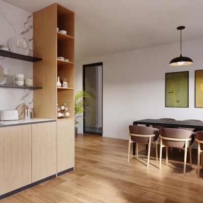 Das Bild zeigt eine moderne Teeküche im Hansahaus Dortmund mit Holzfronten, Spülbecken und Essbereich.