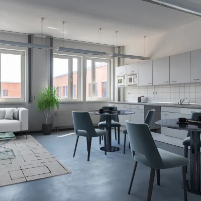 Das Bild zeigt eine Büro-Küche im Kontorhof Teltow mit Küchenzeile, Essbereich und Lounge-Sofa.