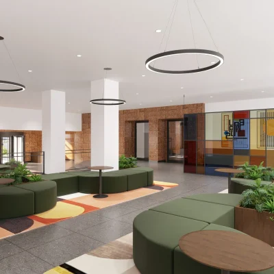 Wartebereich eines Bürogebäudes in Berlin mit Designer-Sitzgruppen und moderner Kunst an den Wänden.