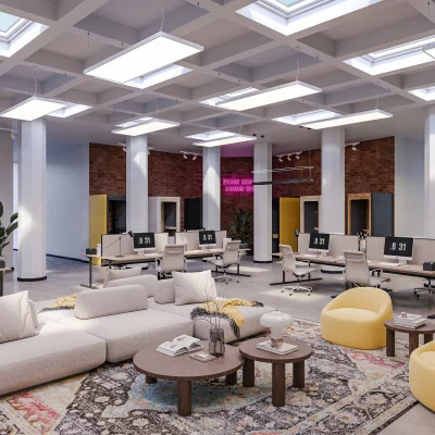 Alt-Text: Großzügiges Open-Space-Büro mit modernen Arbeitsplätzen, lichtdurchfluteter Decke und komfortablem Loungebereich in der Bergstraße 1 in Berlin.