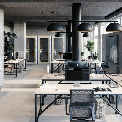 Open-Space-Büro in Sichtbeton-Optik mit Holzschreibtischen, schwarzen Pendelleuchten und Telefonkabinen