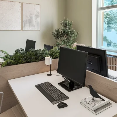 Büro mit zwei Arbeitsplätzen, Pflanzenbegrünung, Fischgrätparkett und Fenster mit Blick in Baumkronen
